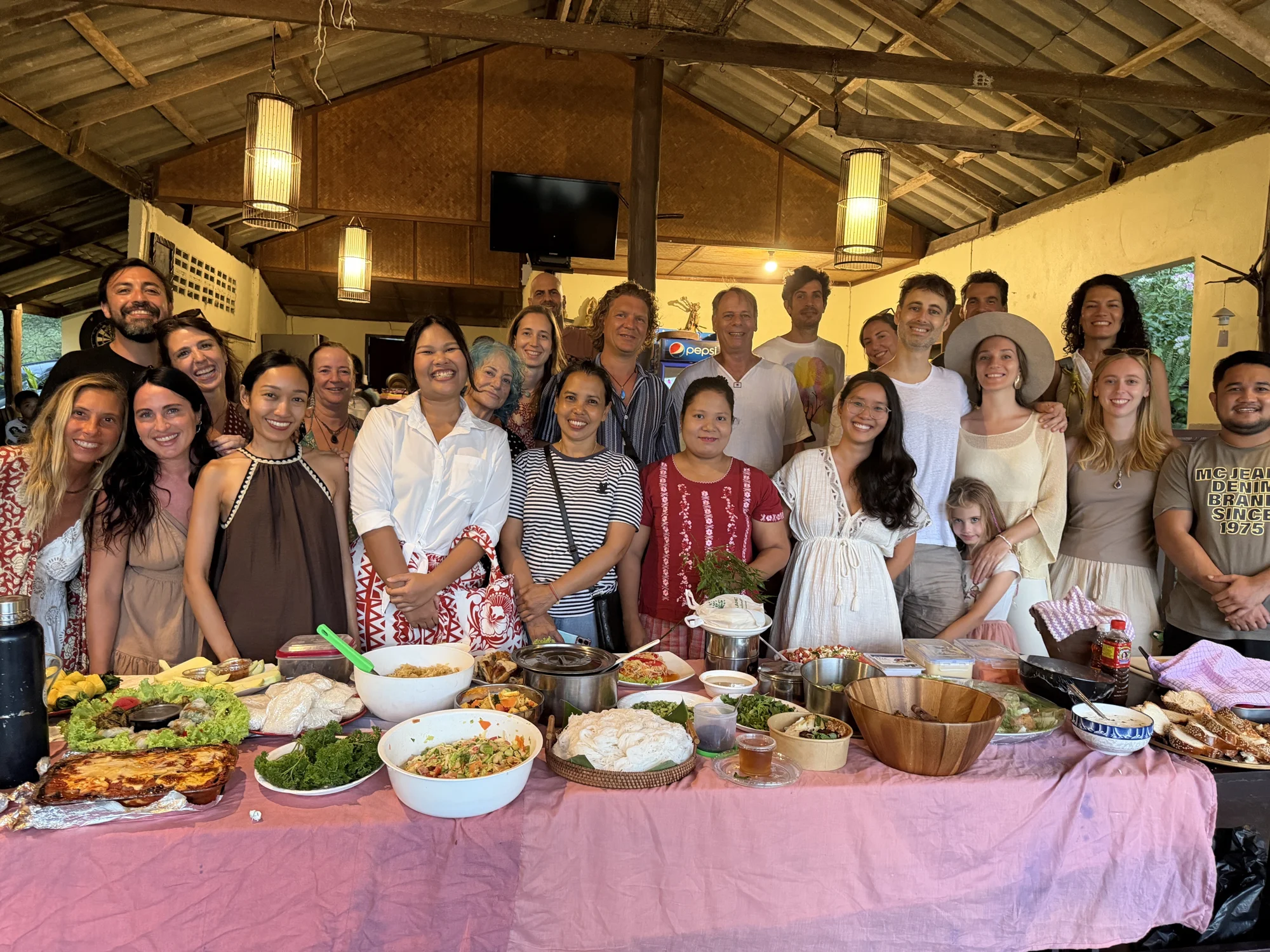 A large group gathered around food at Amagi’s Cultural Night