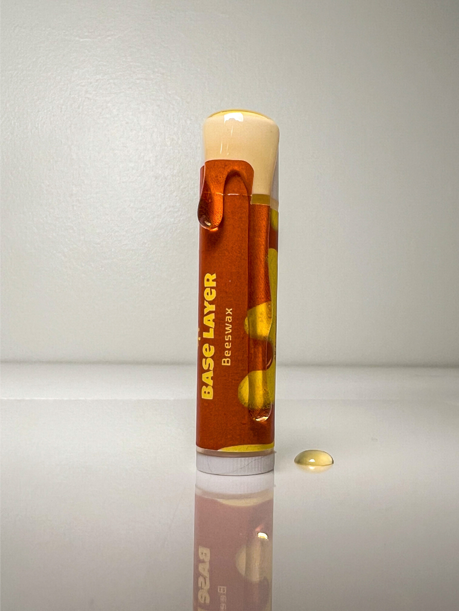 Original Base Layer lip balm with a drop of balm