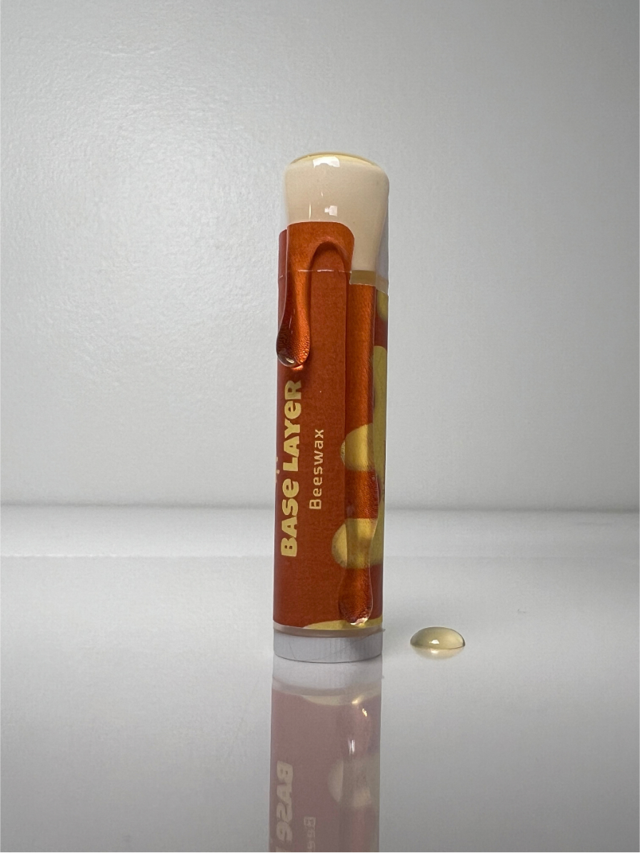 Original Base Layer lip balm with a drop of balm
