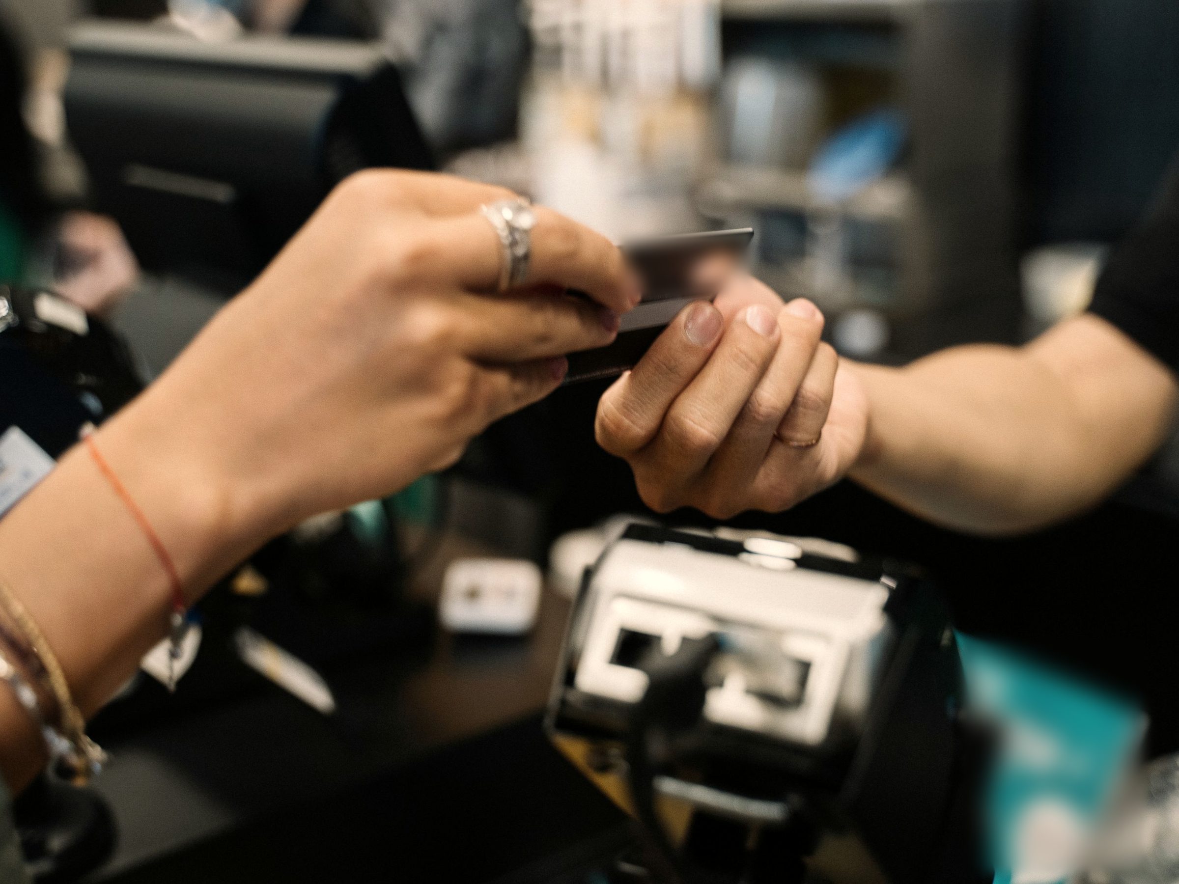 Card handed over at a shop counter