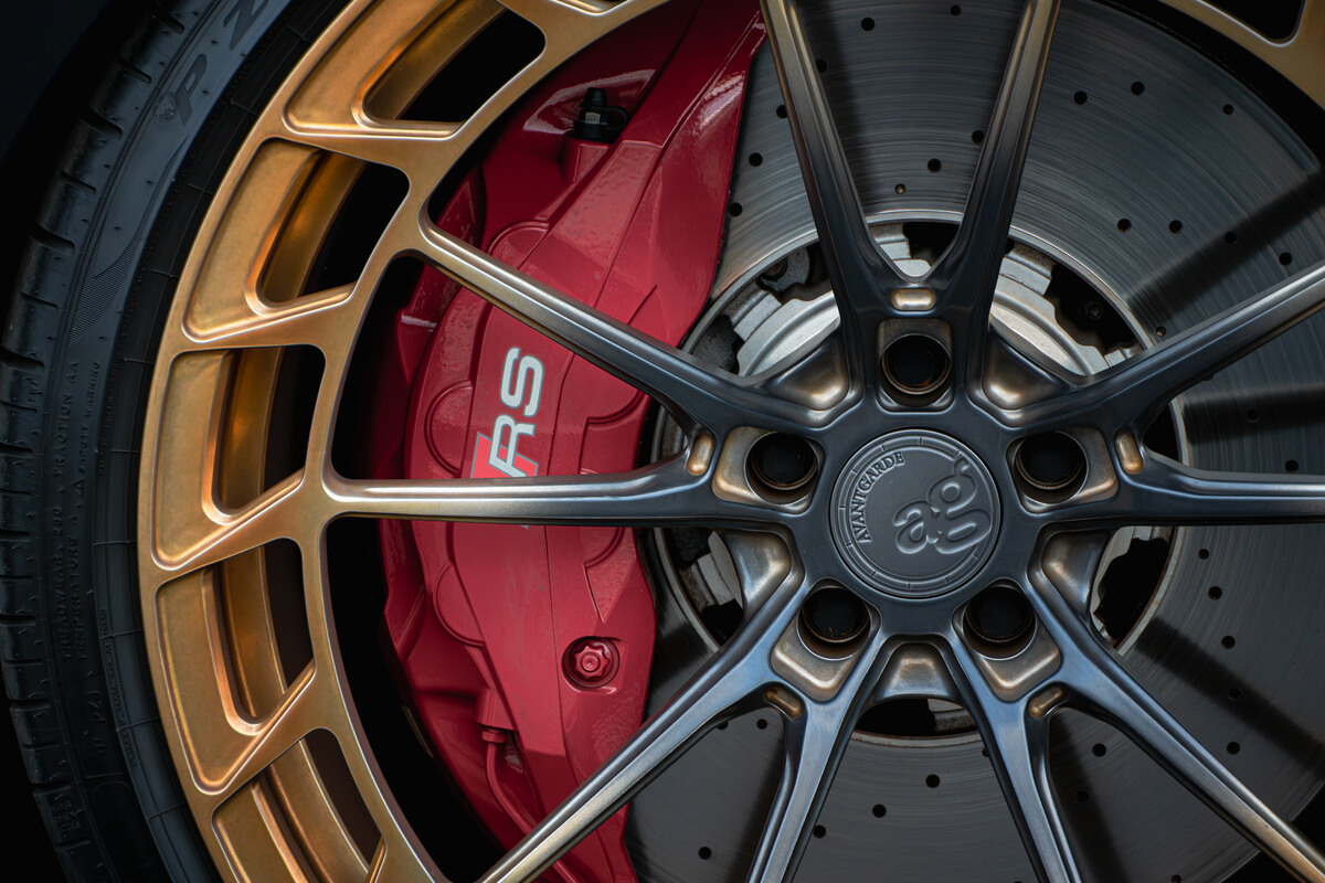 Bronze forged wheel and red RS brake caliper on an Audi RS6