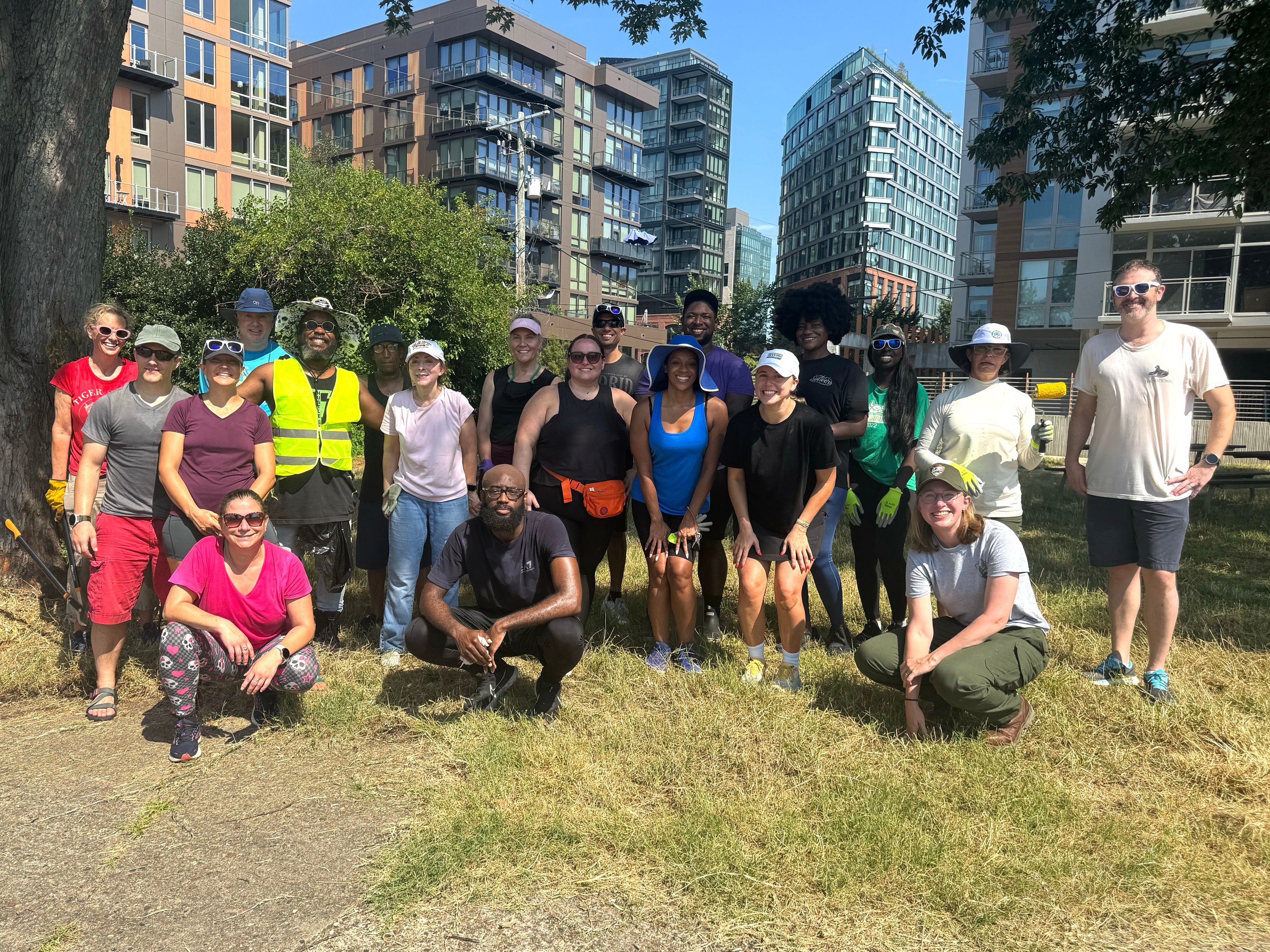 About two dozen volunteers, including a park ranger, after a volunteer day at Buzzard Point Park