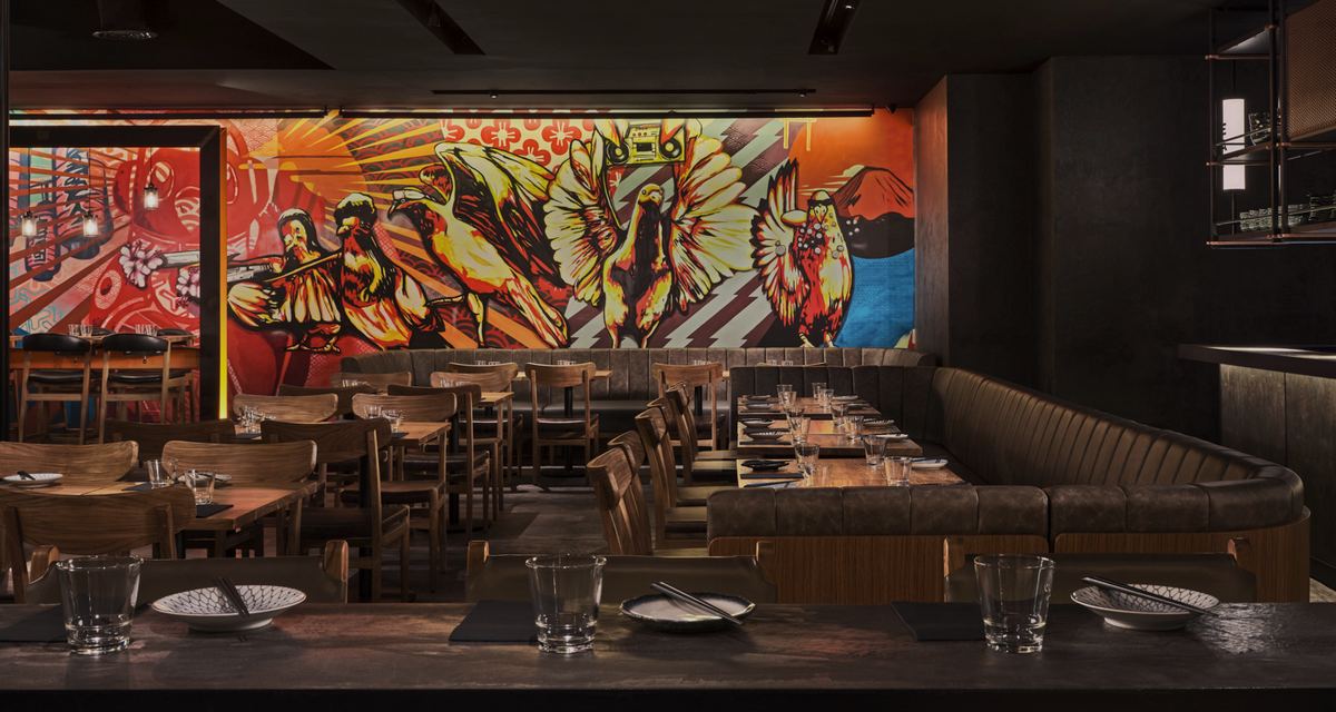 Inside Neon Pigeon, with its pigeon mural