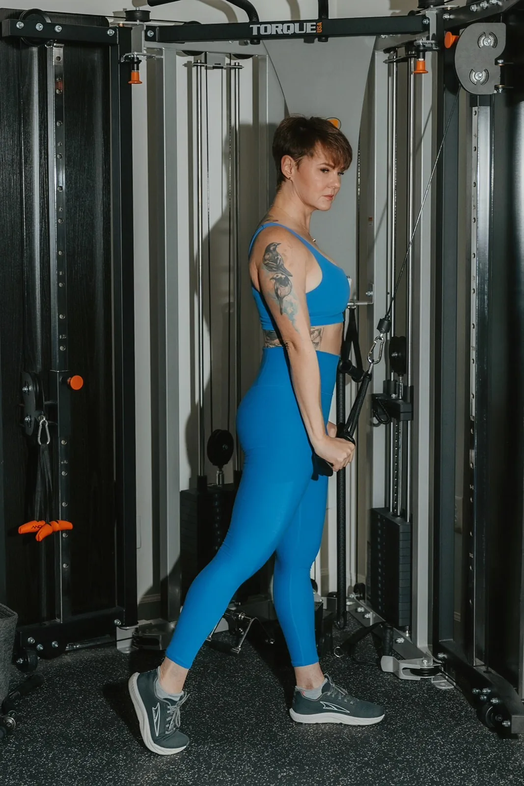 Kate Bolia using the cable training equipment at Apex Dunwoody.