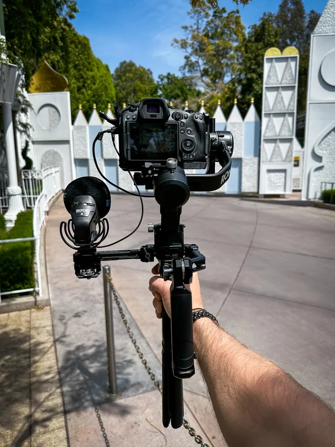 Cinema camera on a handheld stabilizer during an outdoor shoot.