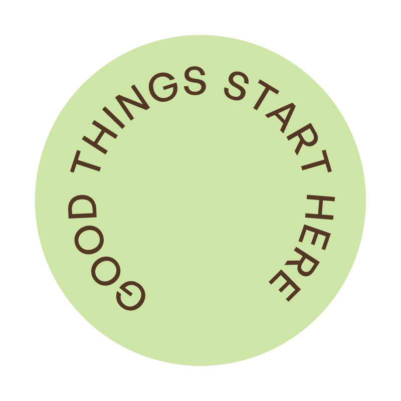 Light green circle with the phrase 'GOOD THINGS START HERE' written in uppercase brown letters arranged in a circular path along the edge of the circle.