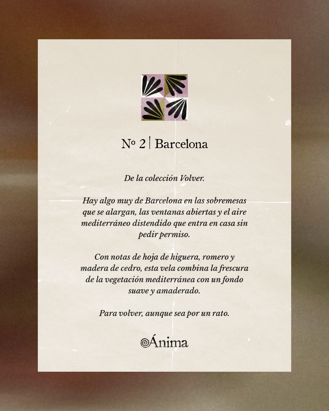 Text content on a beige, slightly textured and creased paper featuring a decorative square pattern on top with black and olive leaf shapes on a mauve background. Below, the heading reads 'No 2 | Barcelona.' The text describes a candle from the Volver collection capturing the essence of Barcelona with extended meals, open windows, and Mediterranean air. It mentions fig leaf, rosemary, and cedarwood notes, blending Mediterranean vegetation freshness with a soft woody base. It ends with the phrase 'Para volver, aunque sea por un rato.' and the brand name Ánima at the bottom.