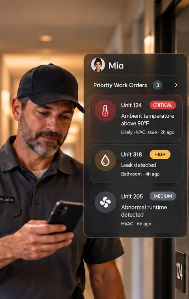 Technician reviewing Mia priority work orders on his phone in an apartment hallway