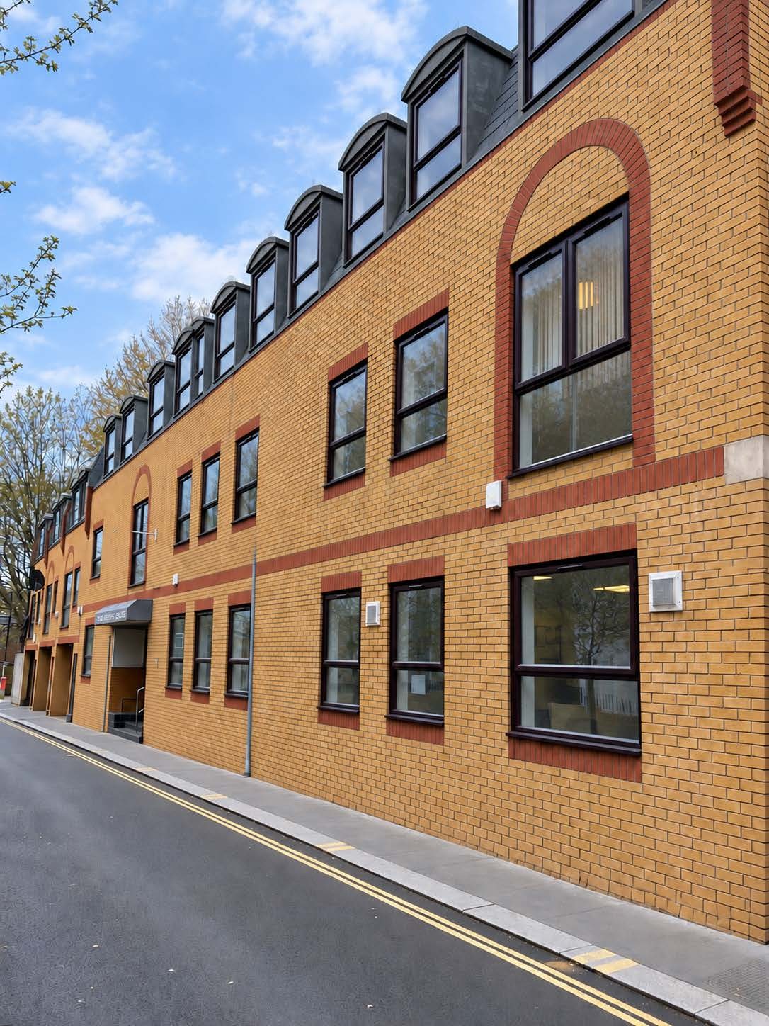 Brick building exterior featured in the Kore brochure