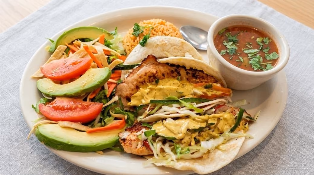 A plate of food with a bowl of soup.