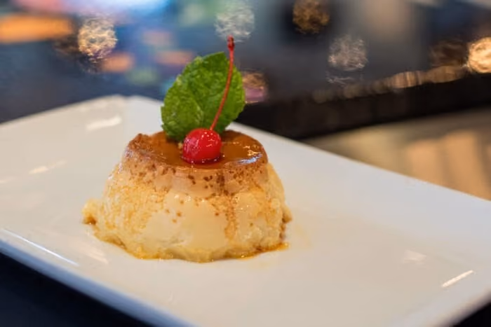 A white plate with a dessert on it.