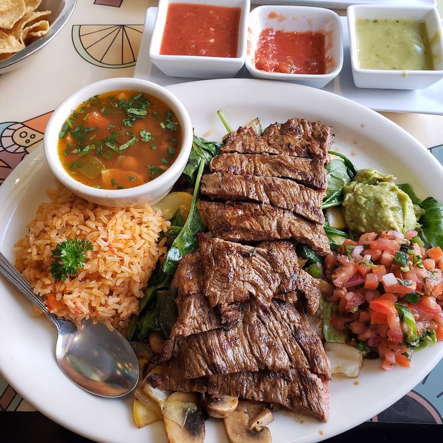 A plate of food with a spoon on it.