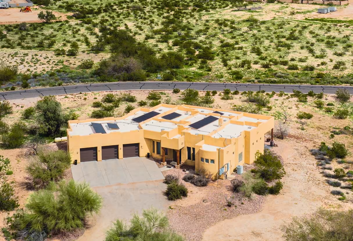 Desert home with solar panels on a flat roof