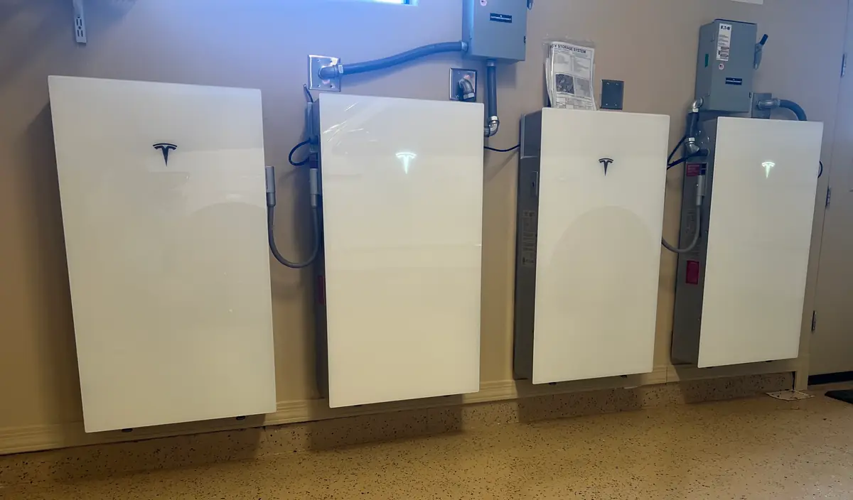 Four Tesla Powerwalls installed side by side in an Arizona garage