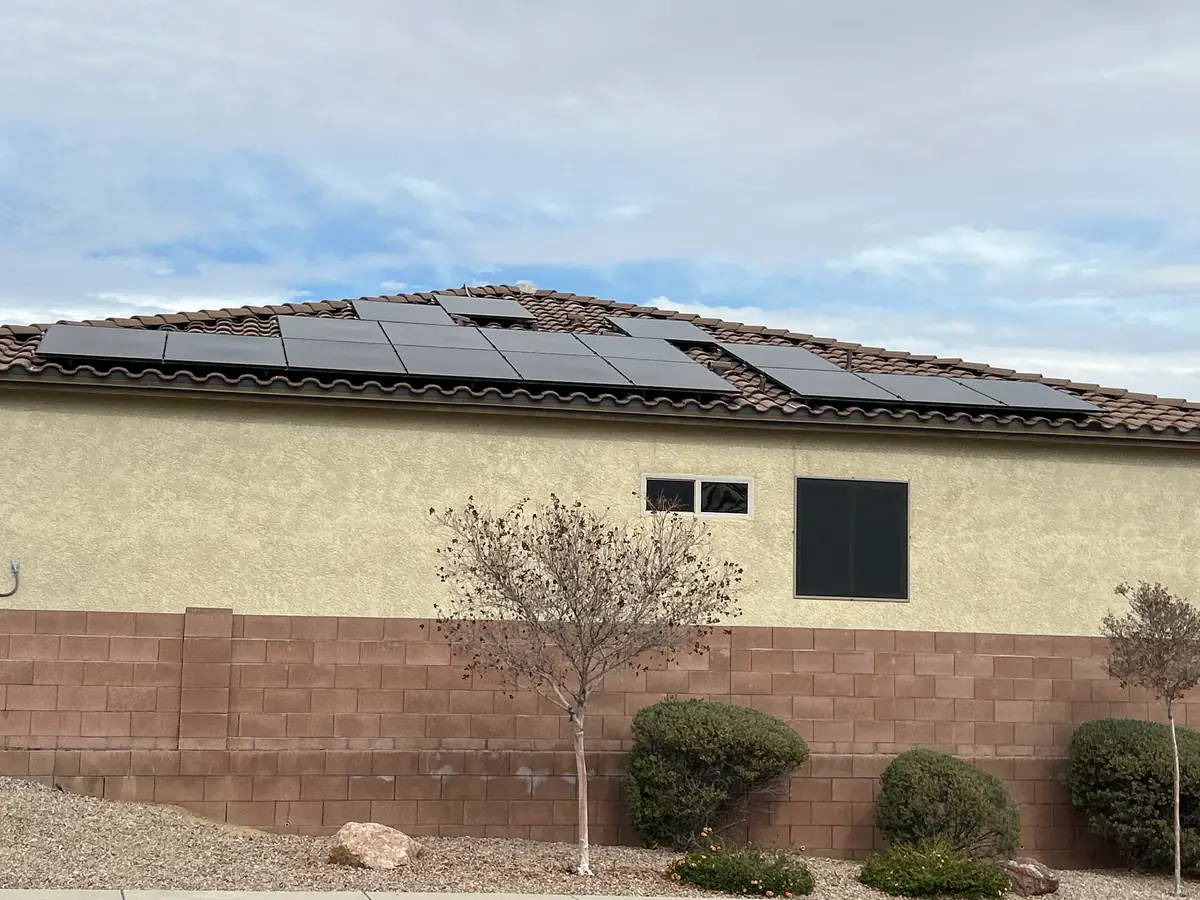 Black solar panels on the tile roof of an Arizona home installed by Icon Power
