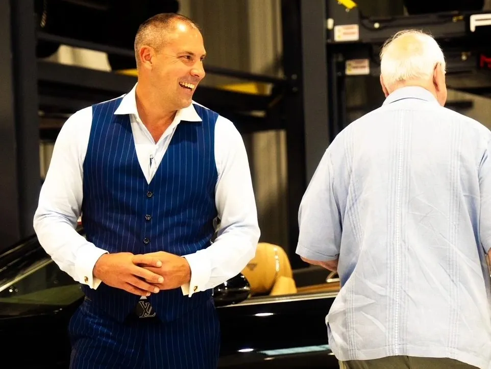 Zack Adams in conversation at an event