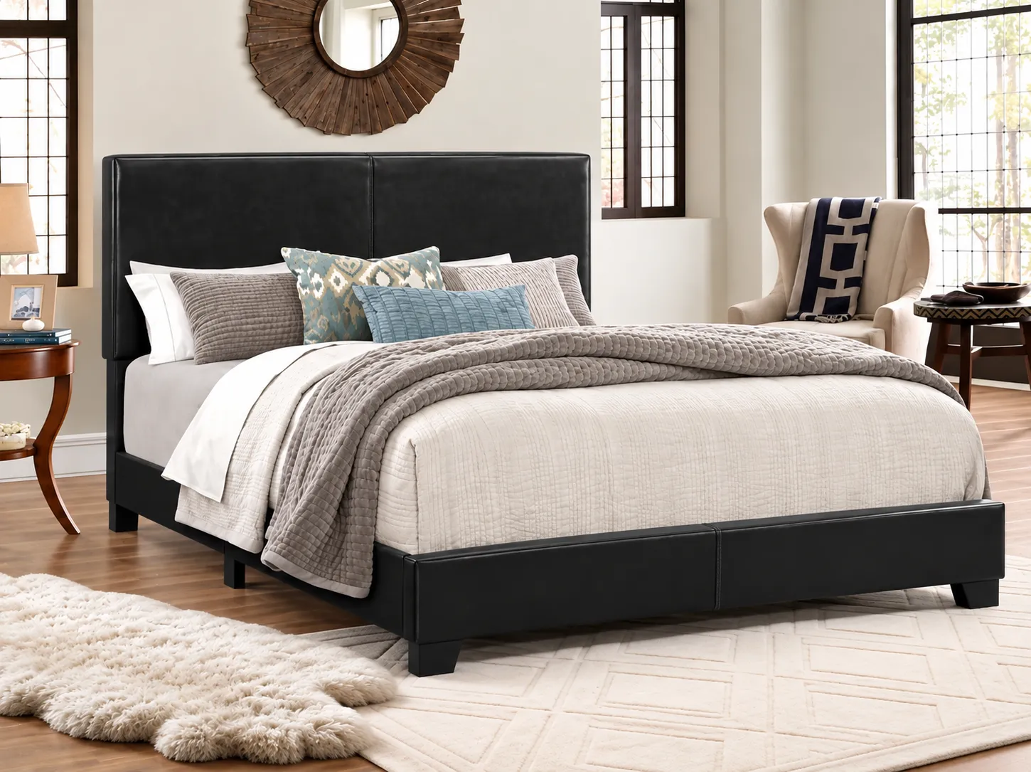 Erin black faux-leather complete bed, made up with bedding