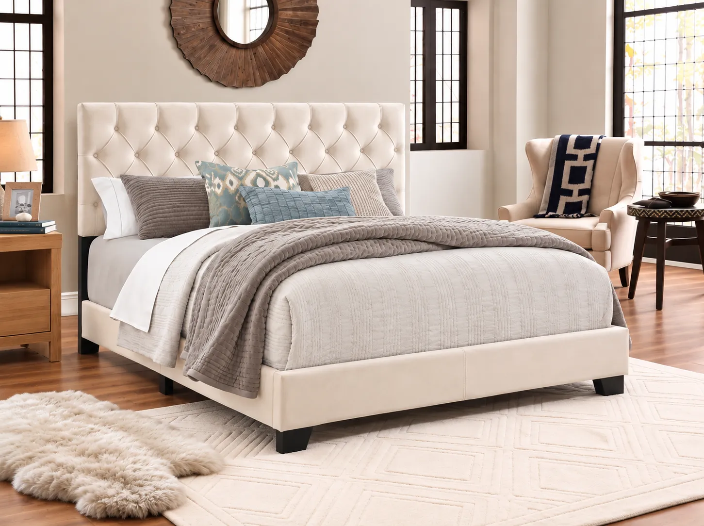 Ivory Tufted Upholstered Bed, made up with bedding