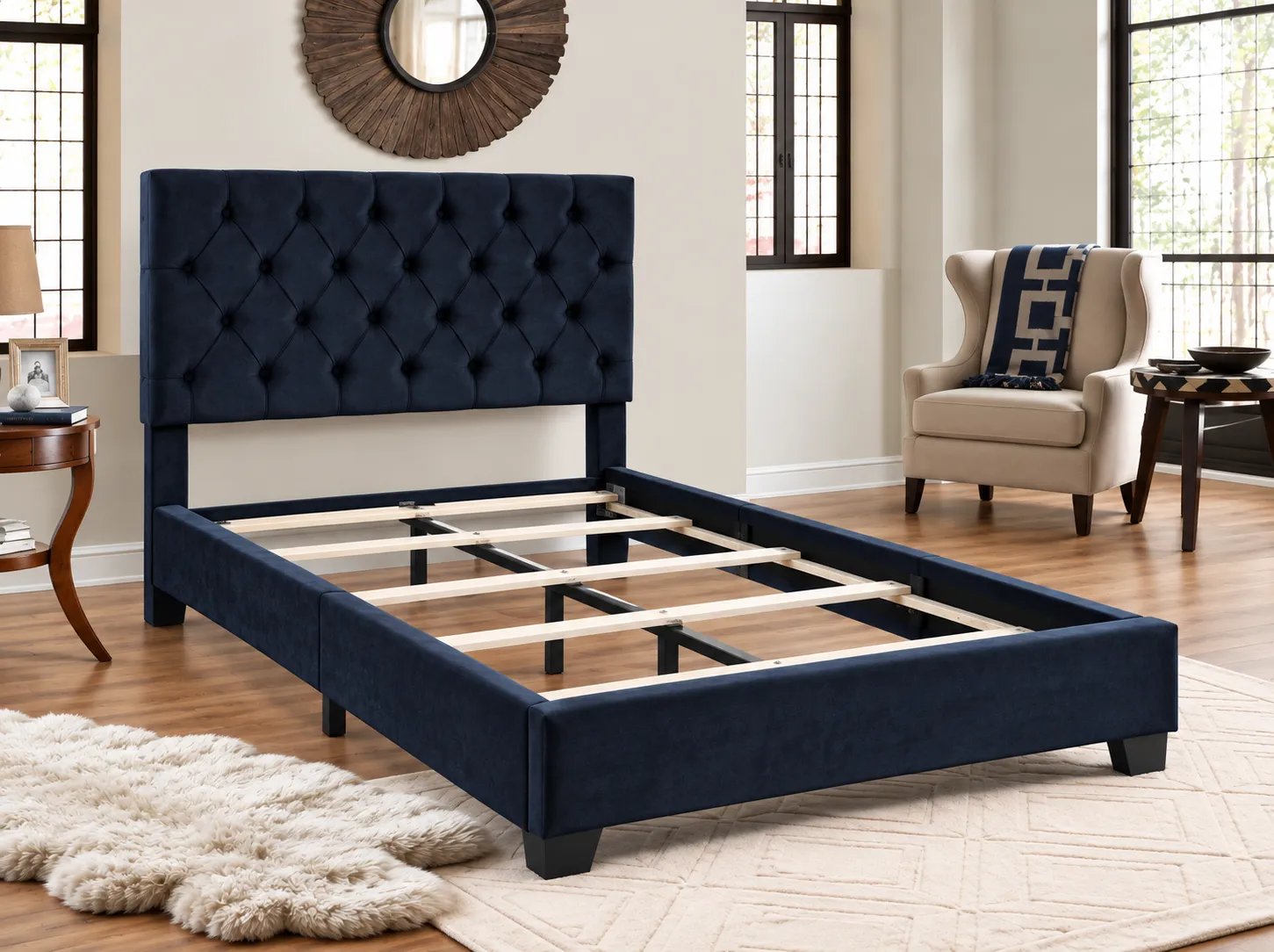Black Tufted Upholstered Bed frame without a mattress, showing the wood slats and center support legs