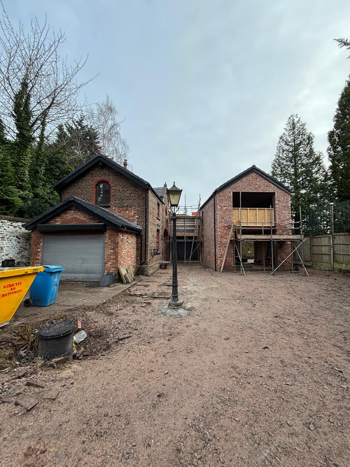The Coach House during construction, with the new wing under scaffold