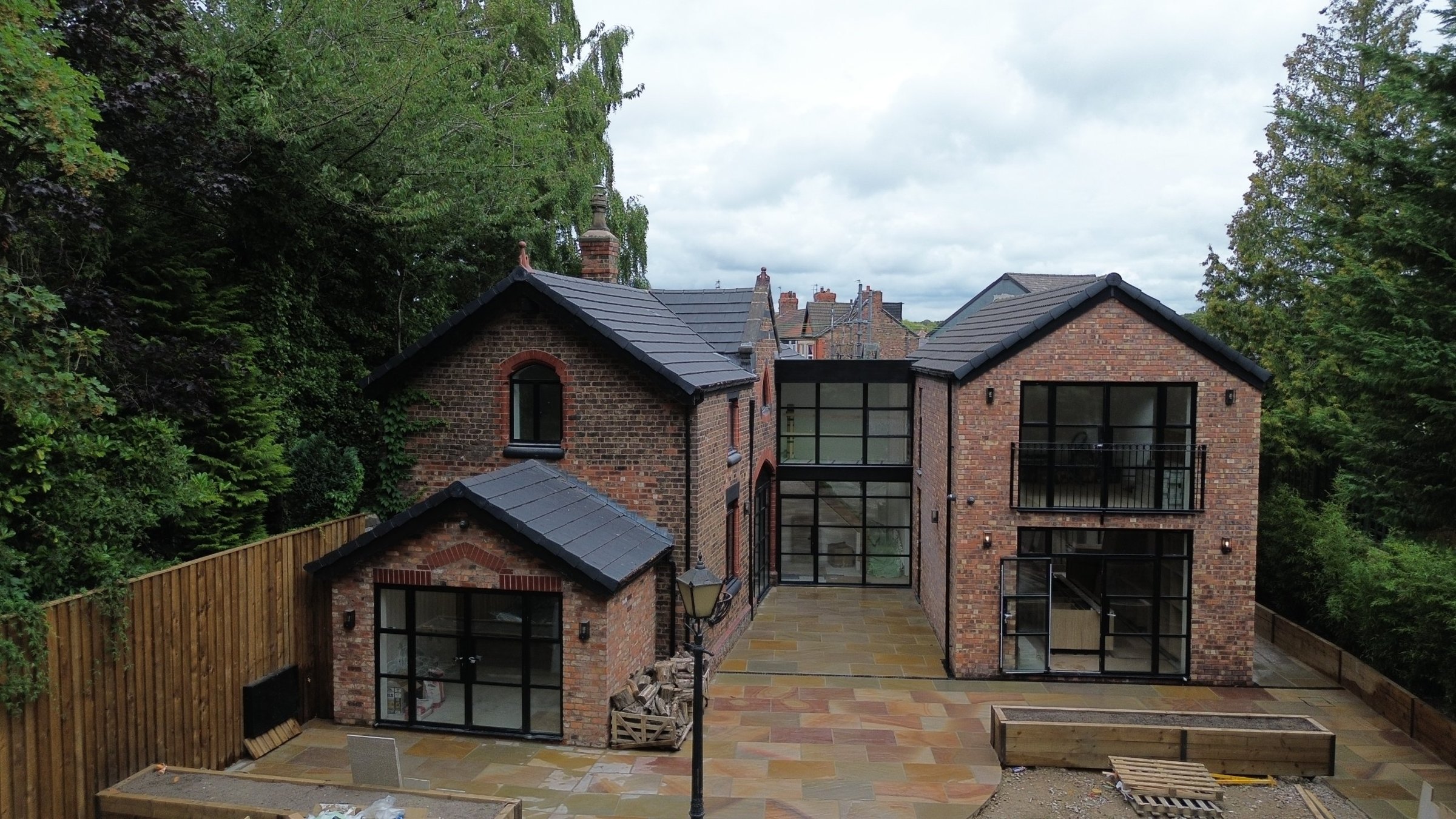 The Coach House courtyard, with the glazed link between the original coach house and the new wing