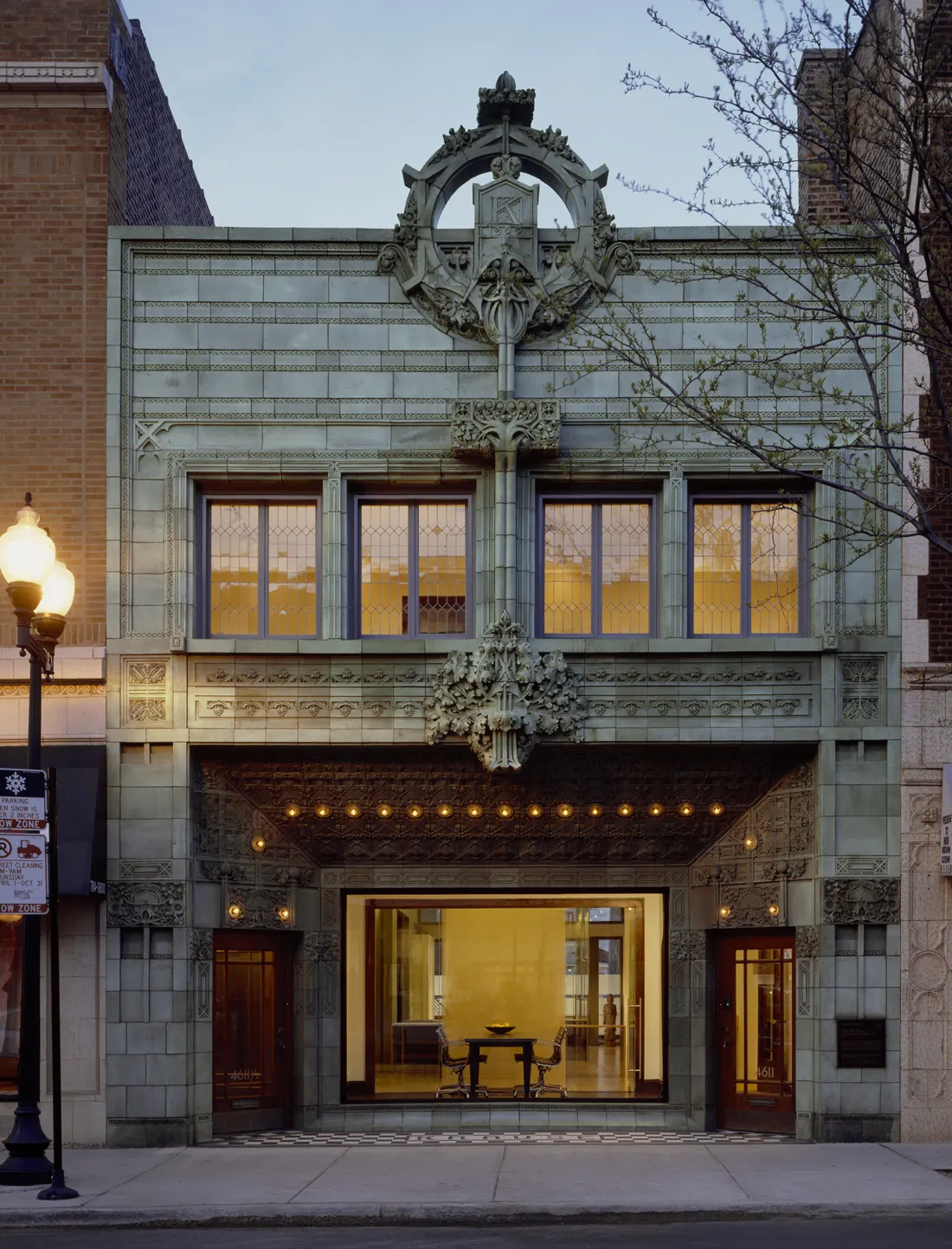 The terracotta façade of 4611 N Lincoln Ave at dusk