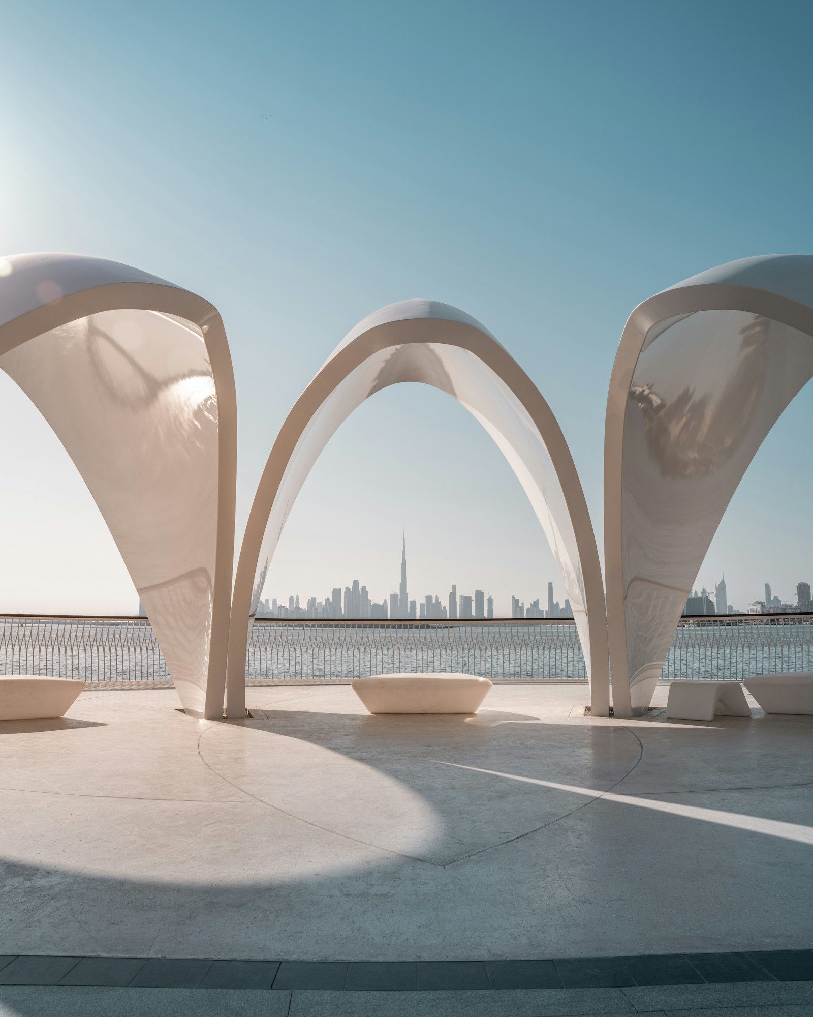 Sculptural waterfront architecture framing the Dubai skyline