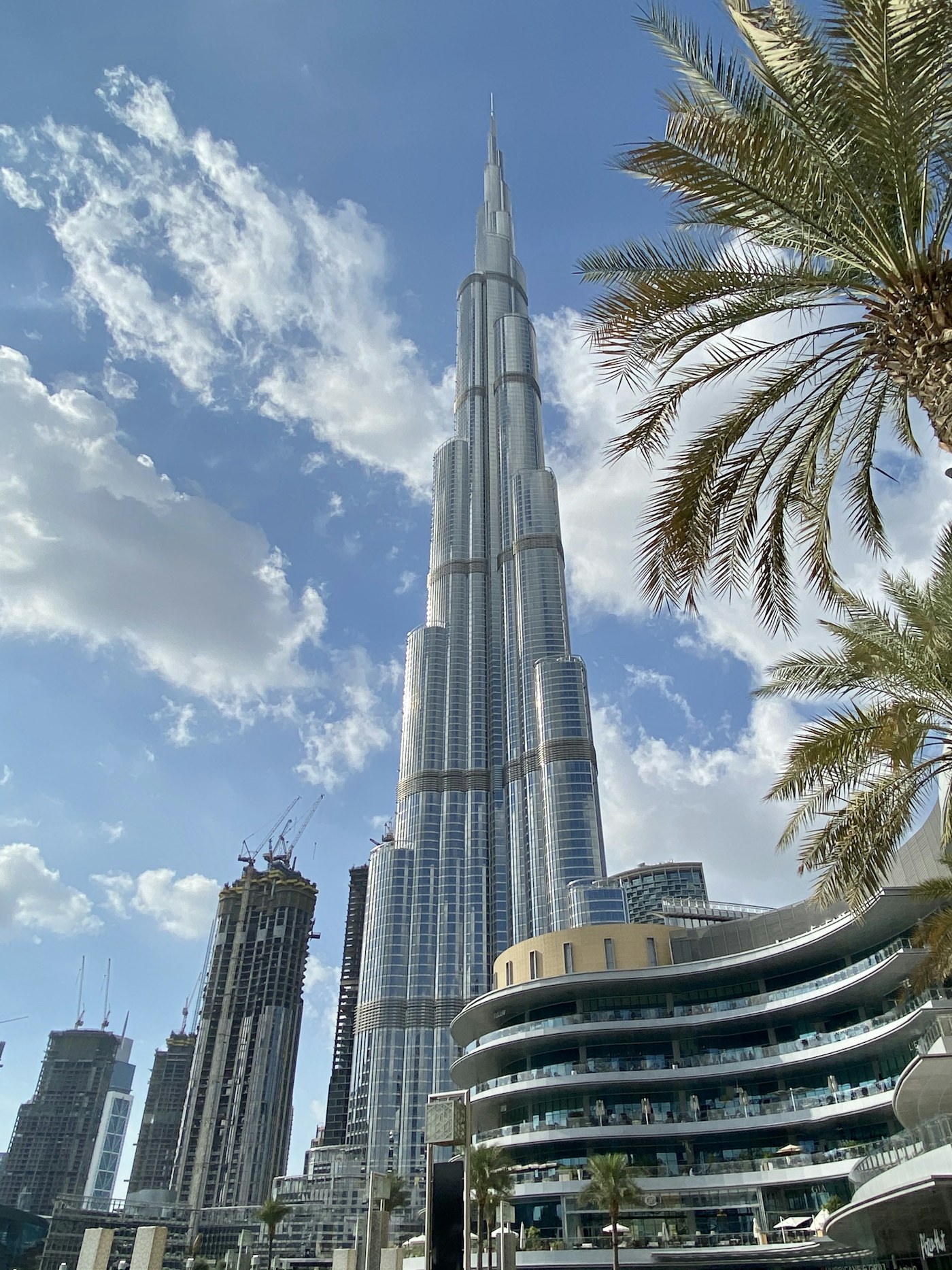 White Dubai tower under a blue sky