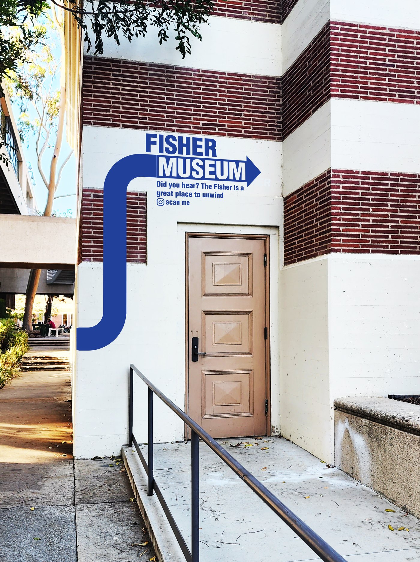 Wayfinding sign on a campus building wall