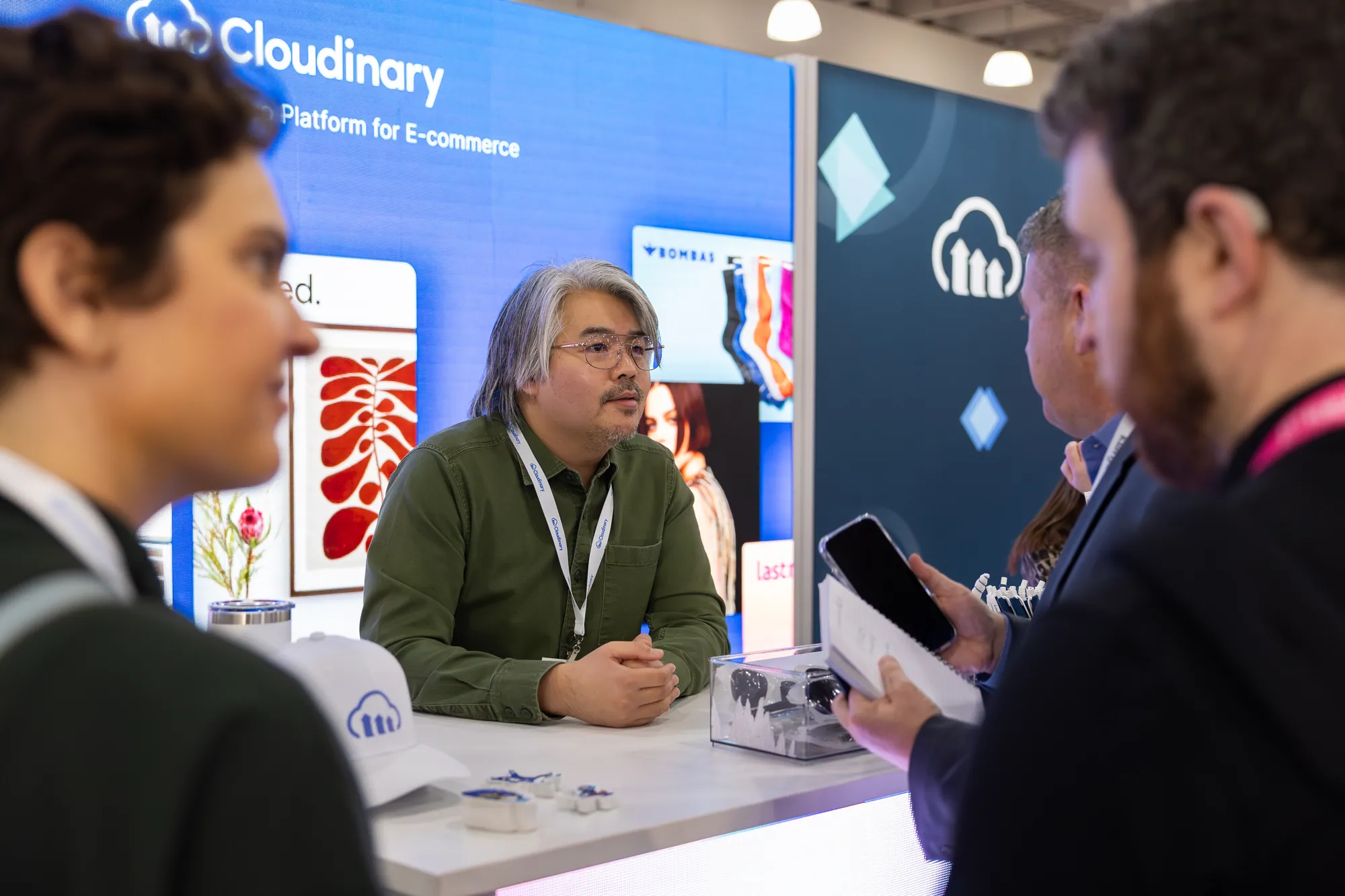 A Cloudinary team member giving a demo at the counter