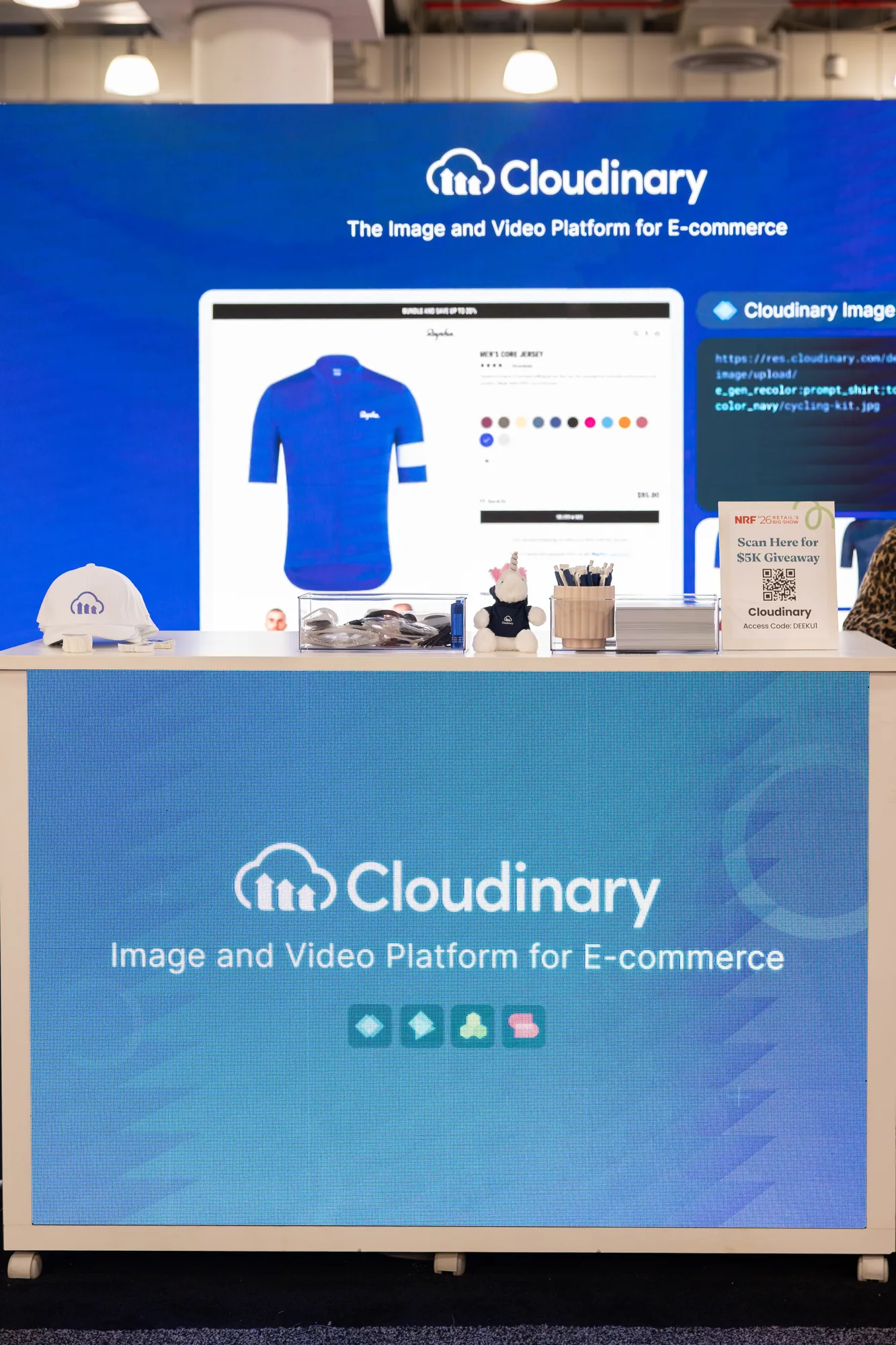 Booth counter with a product demo screen and the Cloudinary wrap