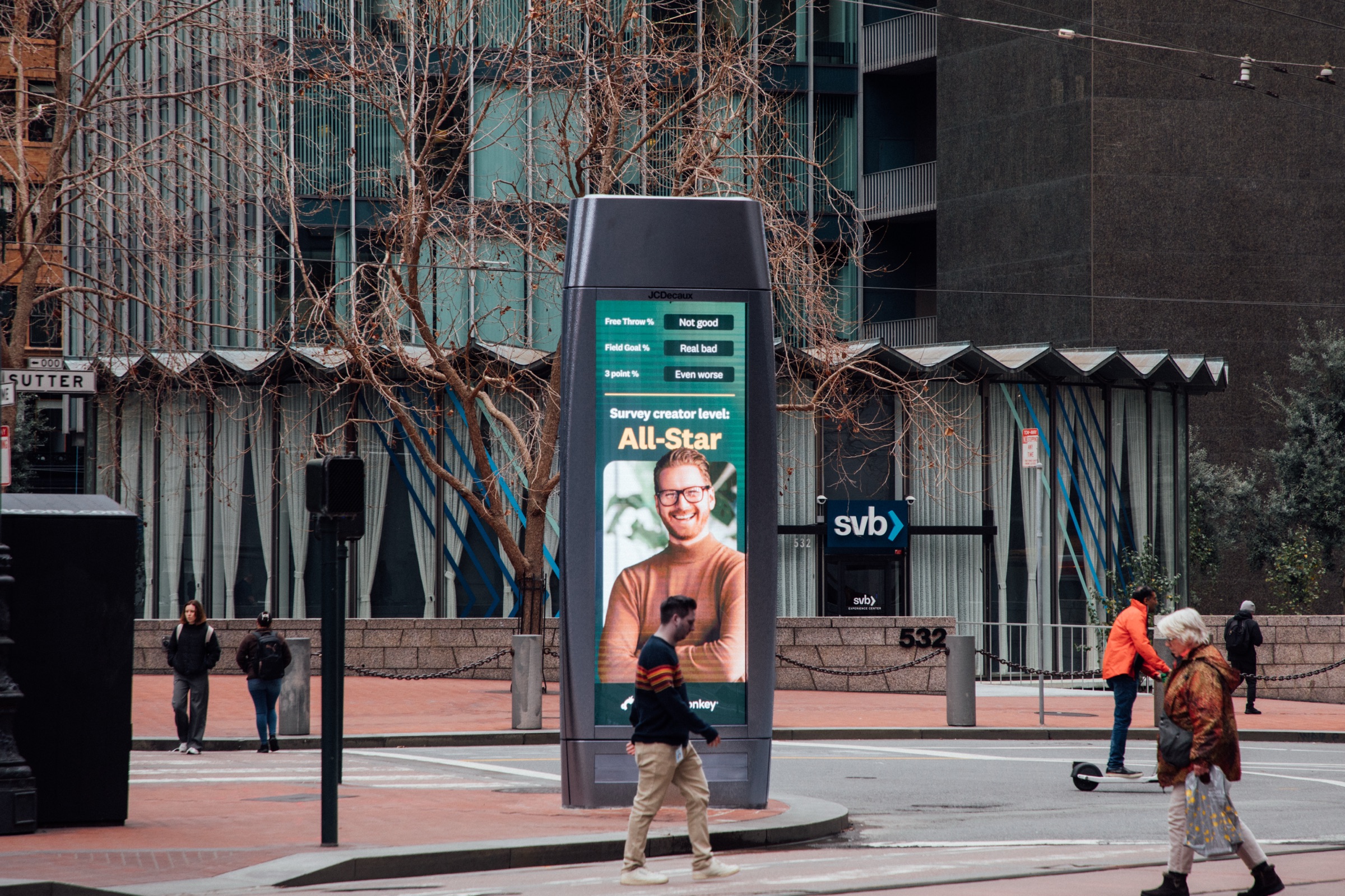 Street-level digital kiosk with a SurveyMonkey All-Star ad