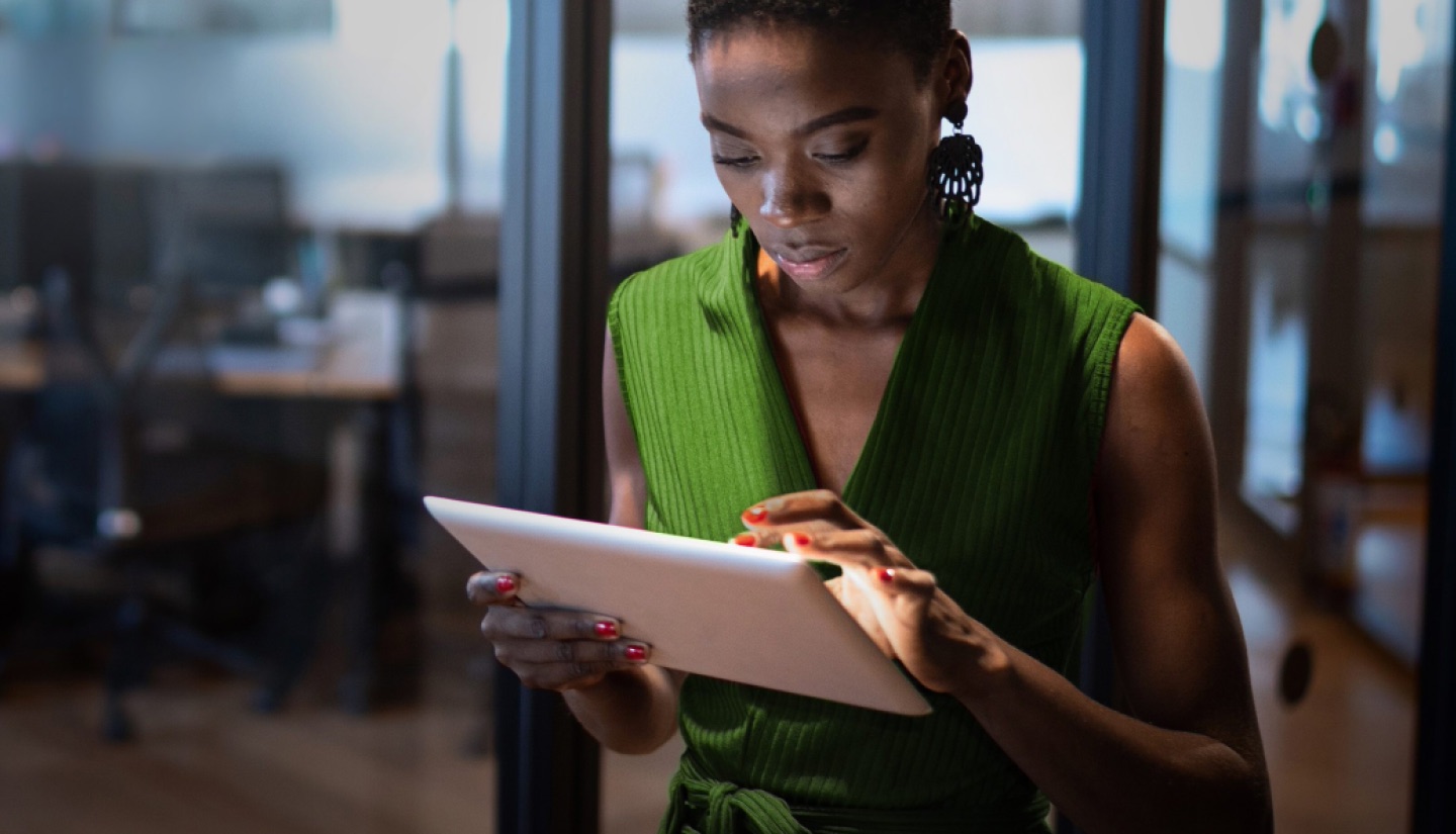 A business buyer reviewing insights on a tablet