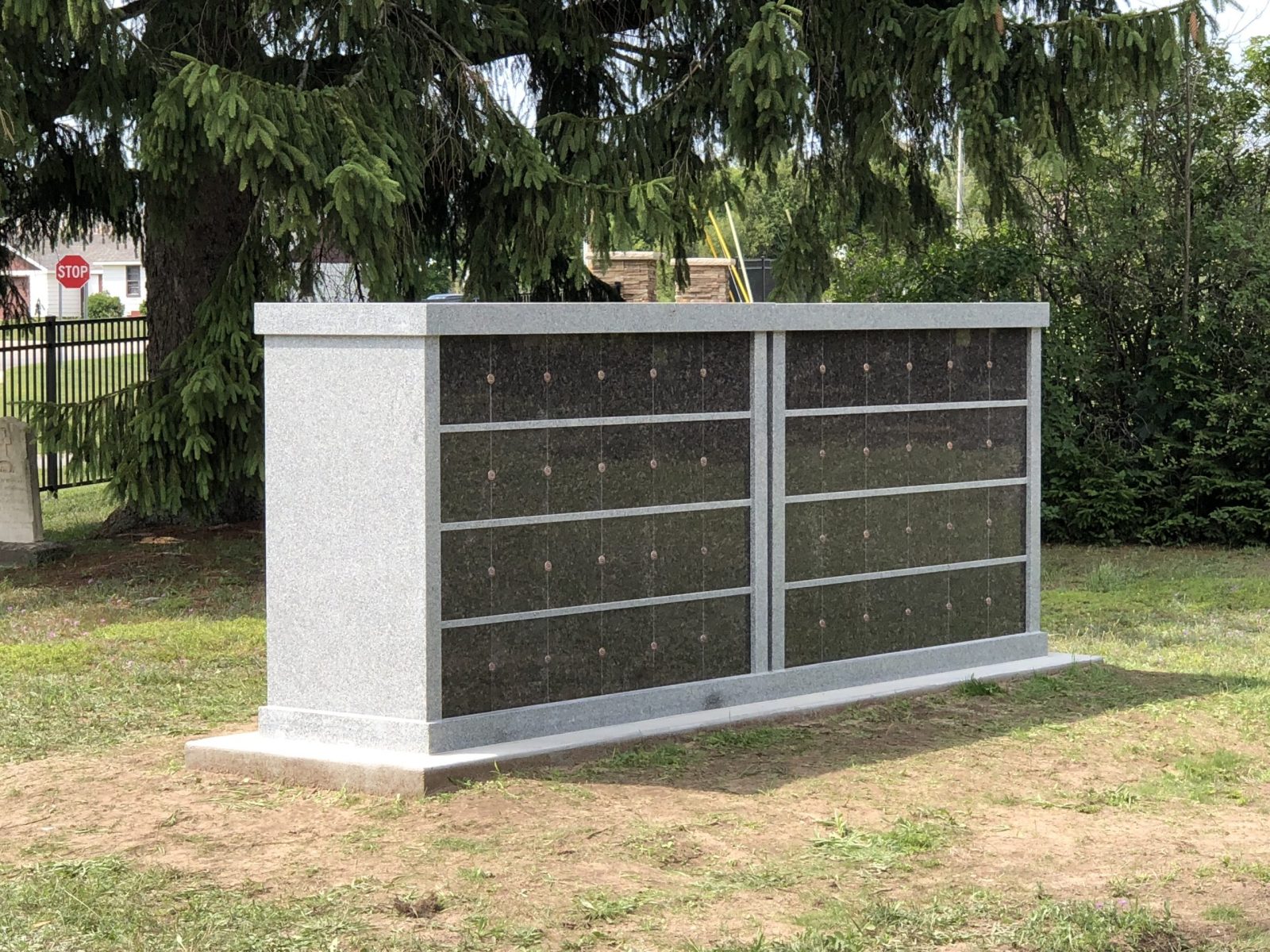 Grey granite columbarium in a cemetery