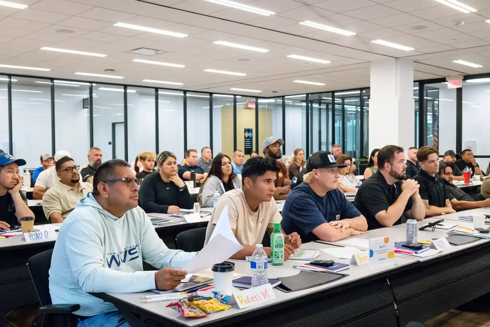 A full classroom of students at an Illinois public adjuster exam prep class