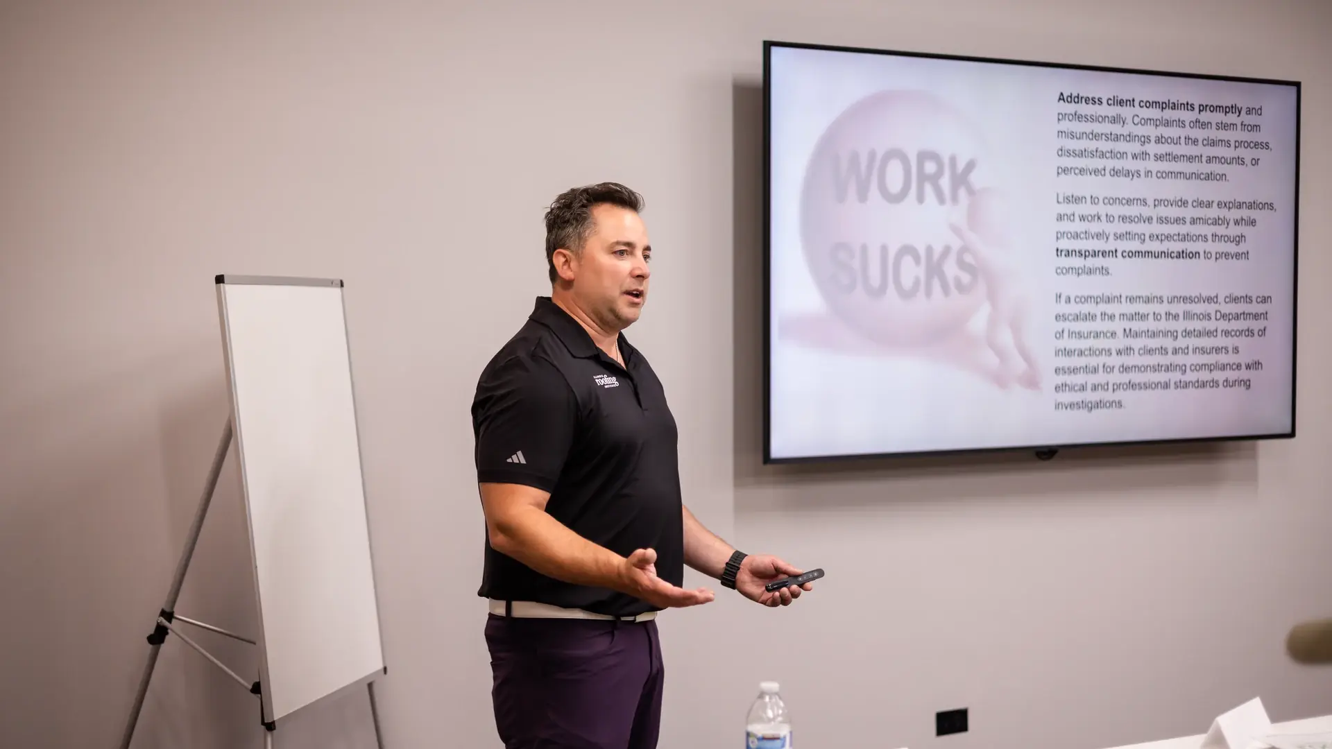 An instructor presenting a lesson on handling client complaints