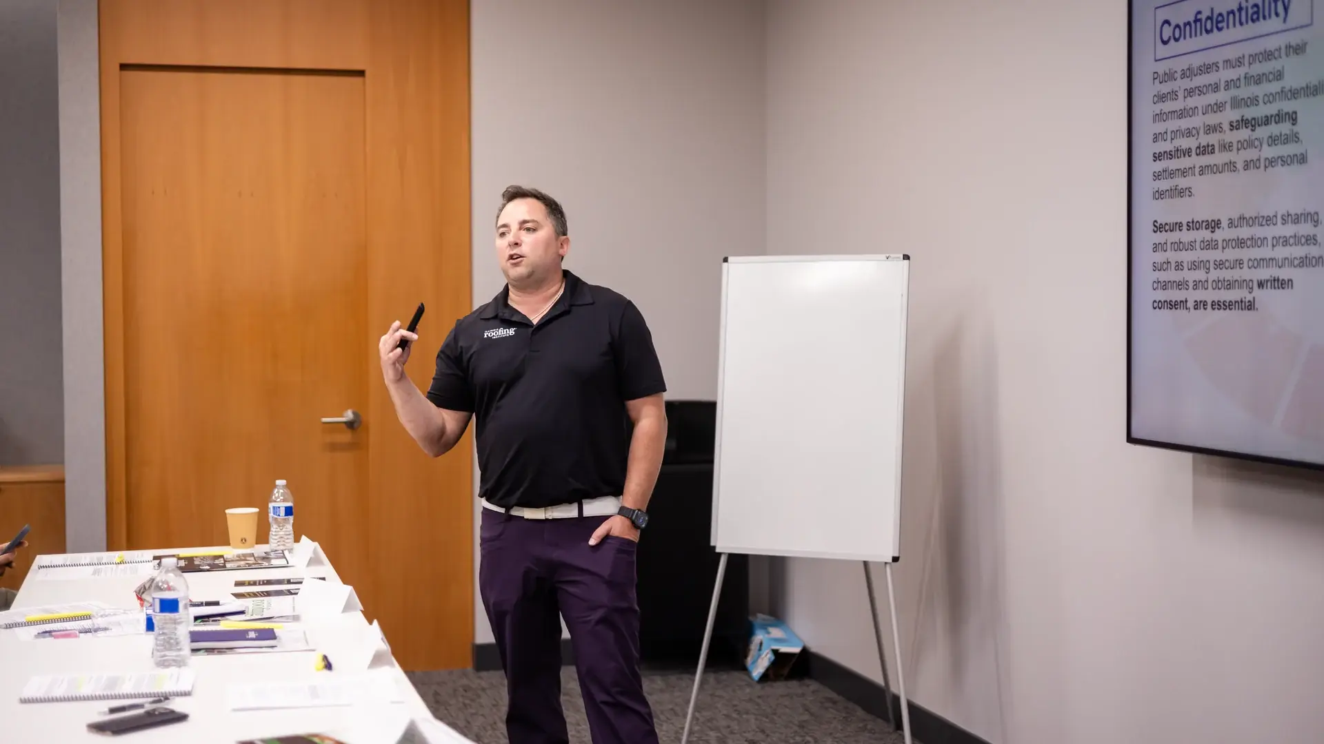 An instructor teaching a lesson on client confidentiality in a public adjuster class