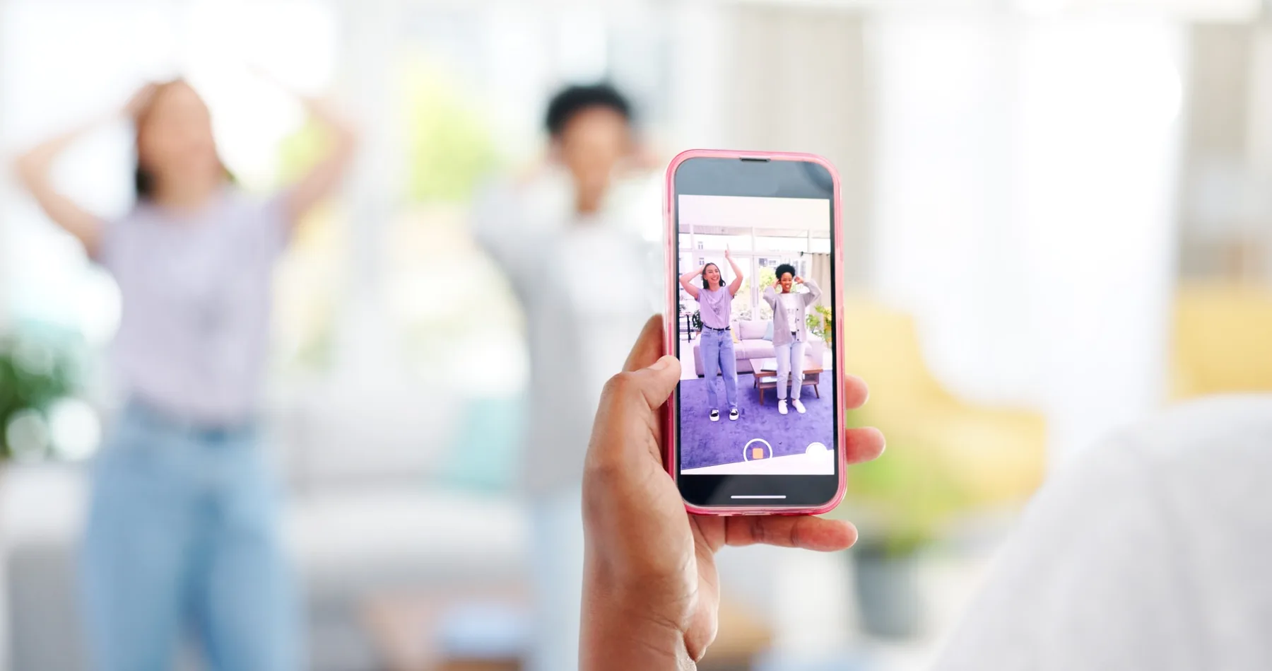 Social media creator recording short-form video content on a smartphone