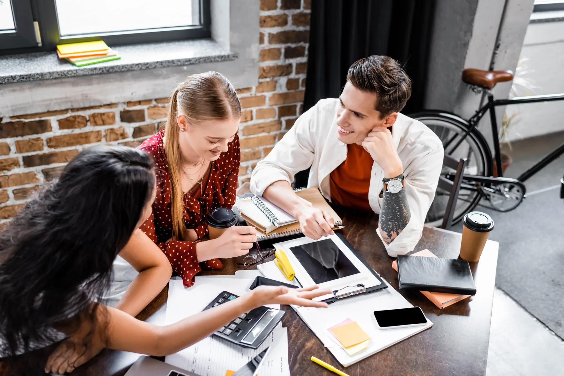 Team collaborating around a project during a working session