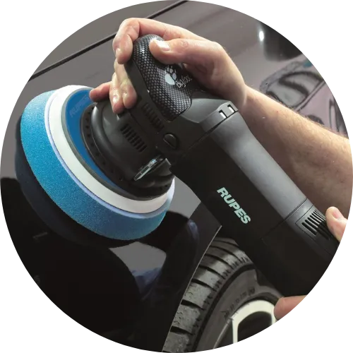 Machine polisher buffing a car's paint