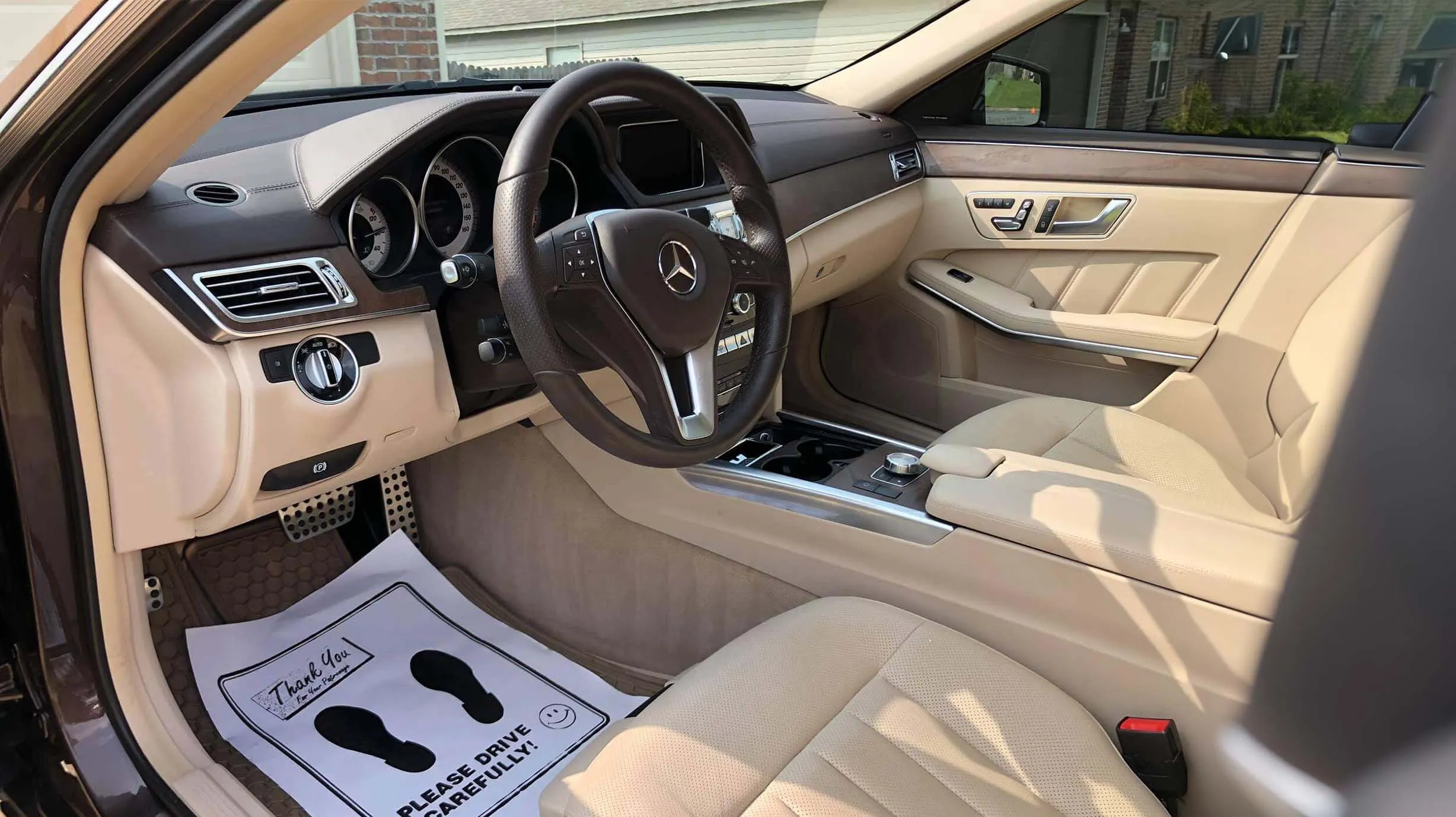 Clean tan leather Mercedes interior after an interior detail