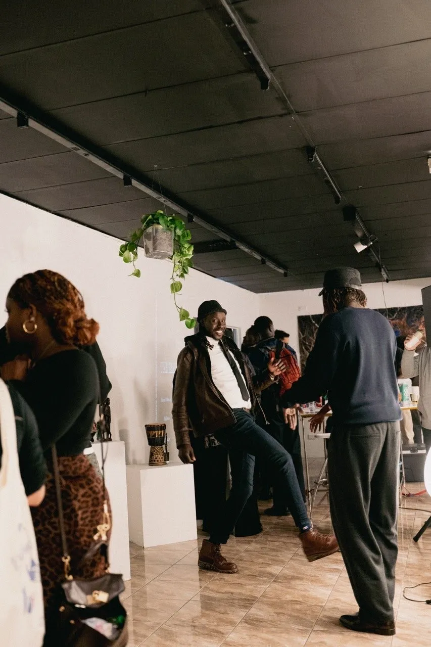 A full room at an exhibition opening in Trou Space