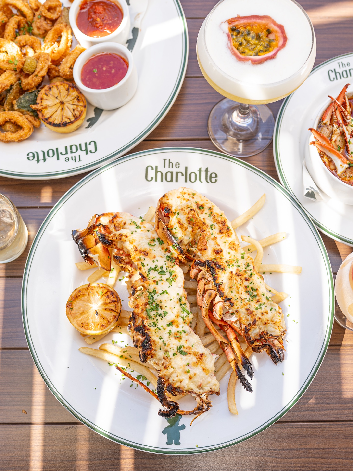Lobster thermidor with frites, calamari and a passion fruit sour