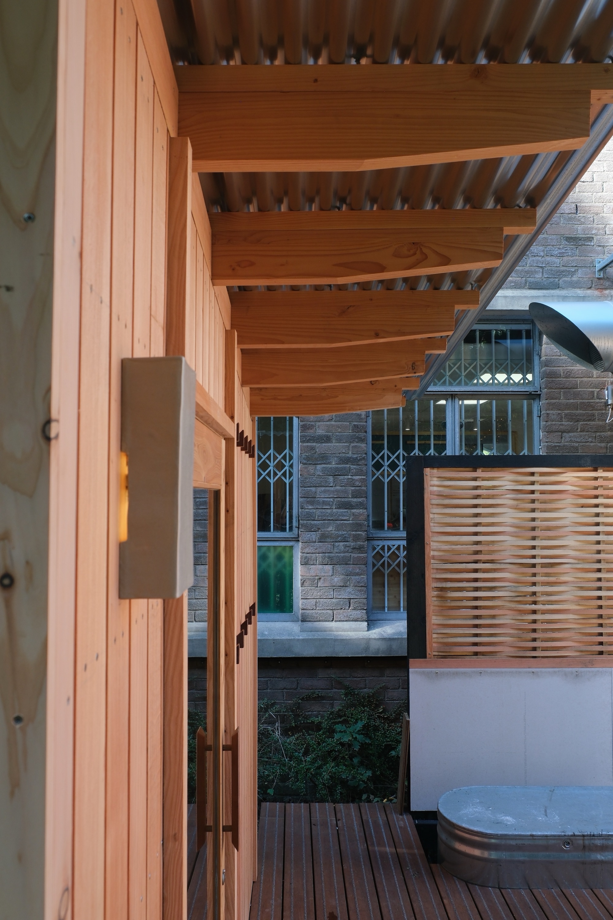 Exposed tapered Douglas fir roof rafters on a timber sauna in Bristol