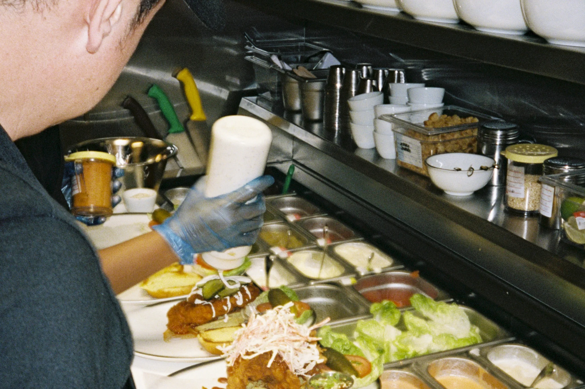 Restaurant employee preparing food for customers