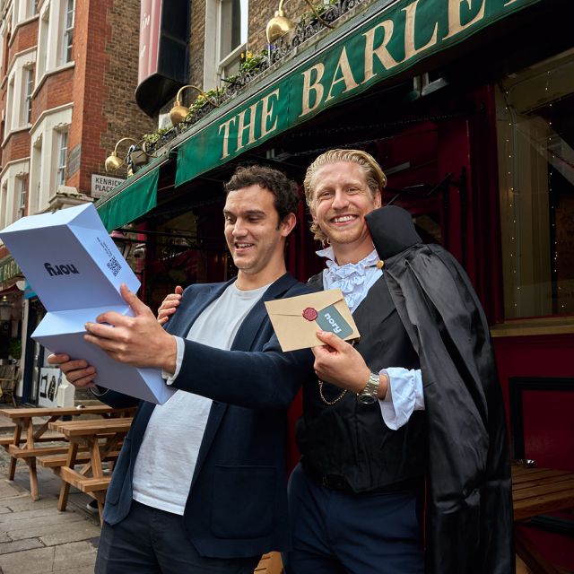 Two Nory team members smiling outside a pub in London