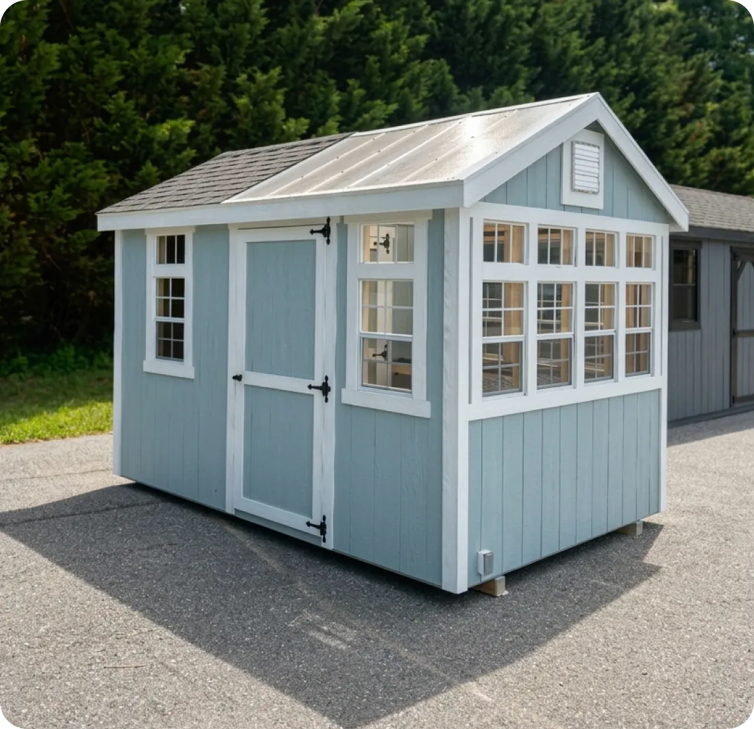 Light blue shed with white trim, a single door, and multiple windows.