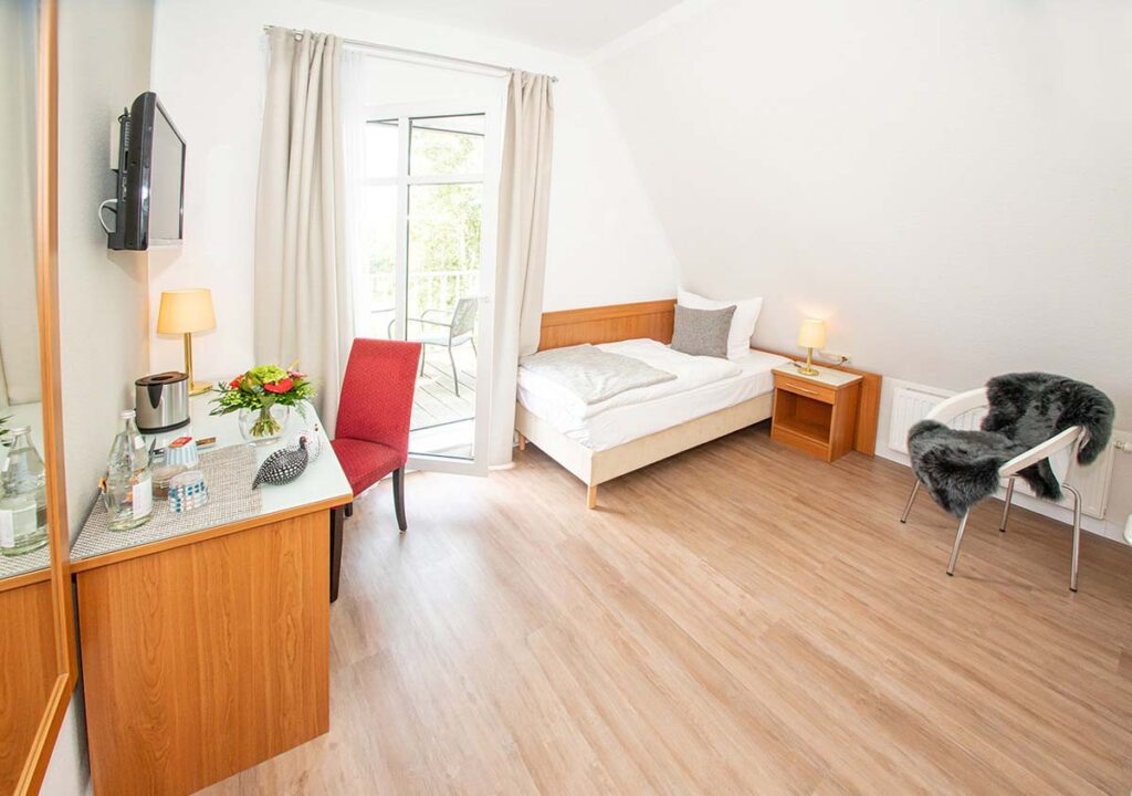 Bright single room with balcony access at LH Hotels Lilienthal