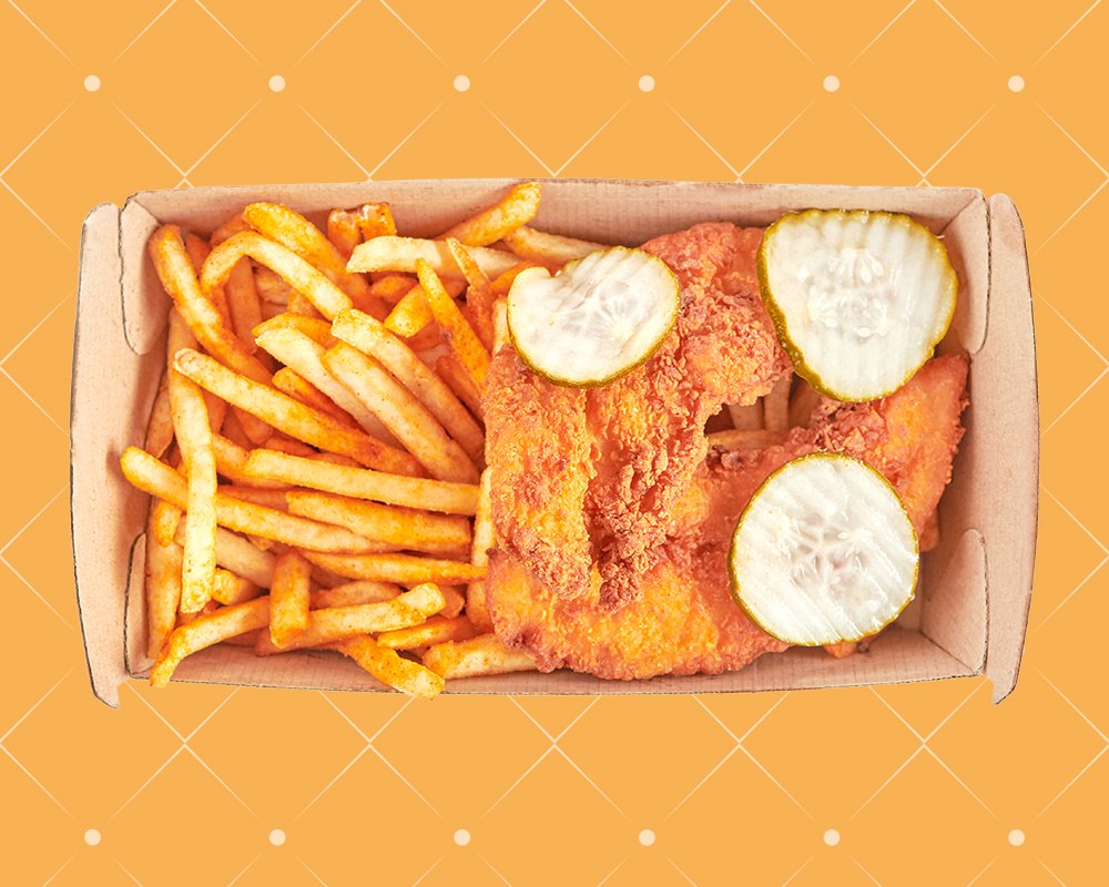 Chicken tenders, pickles and seasoned fries in a box