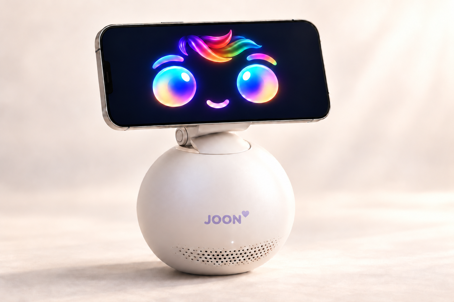 JOON product visualisation: a matte white spherical robot with a lavender JOON heart logo, holding a landscape phone with multicoloured eyes, eyebrows, digital hair and a smile.
